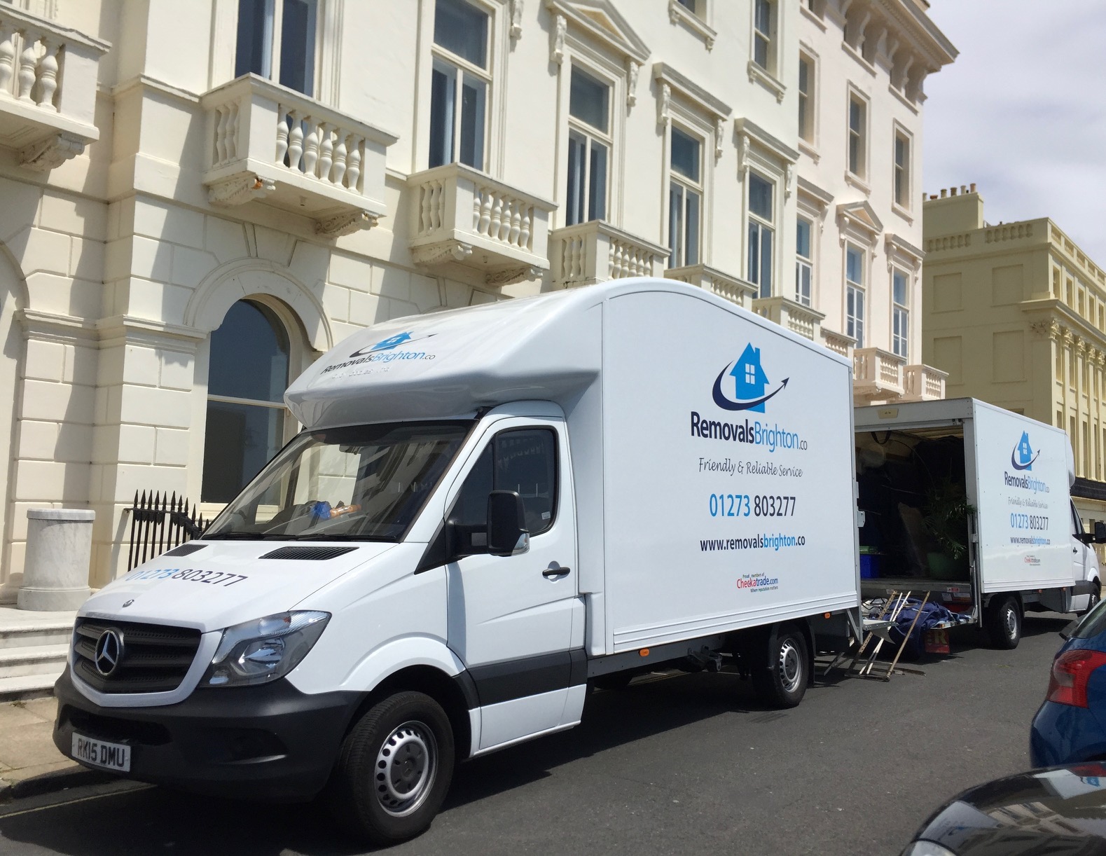 Removals Brighton vans on a Brighton Regency terrace