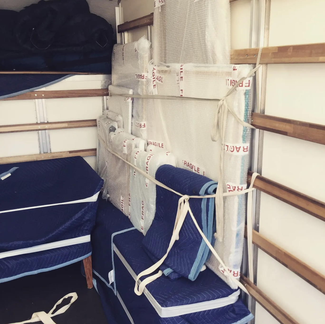 Professionally packed fragile items inside Removals Brighton van