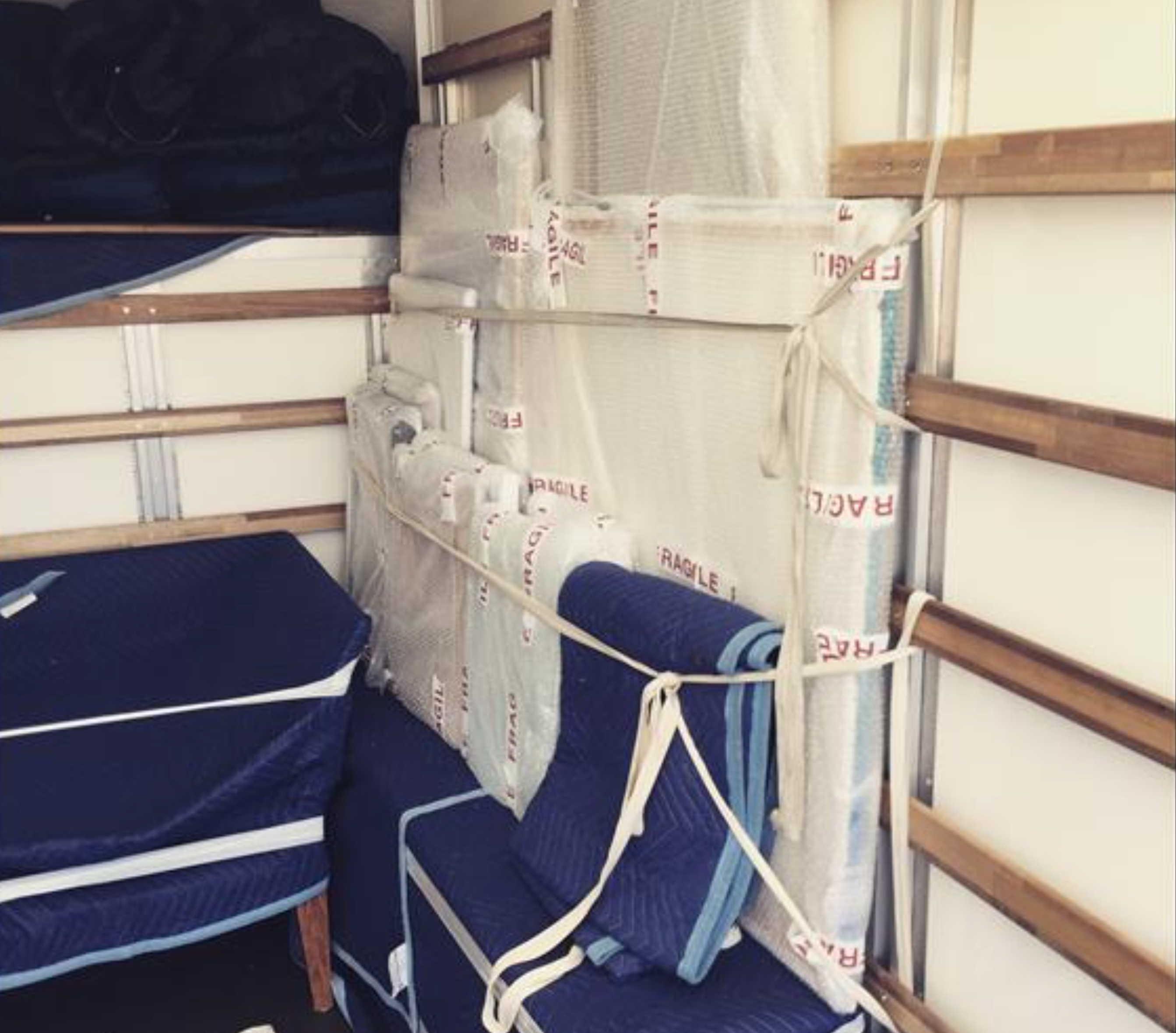 Fragile items securely strapped inside Removals Brighton van