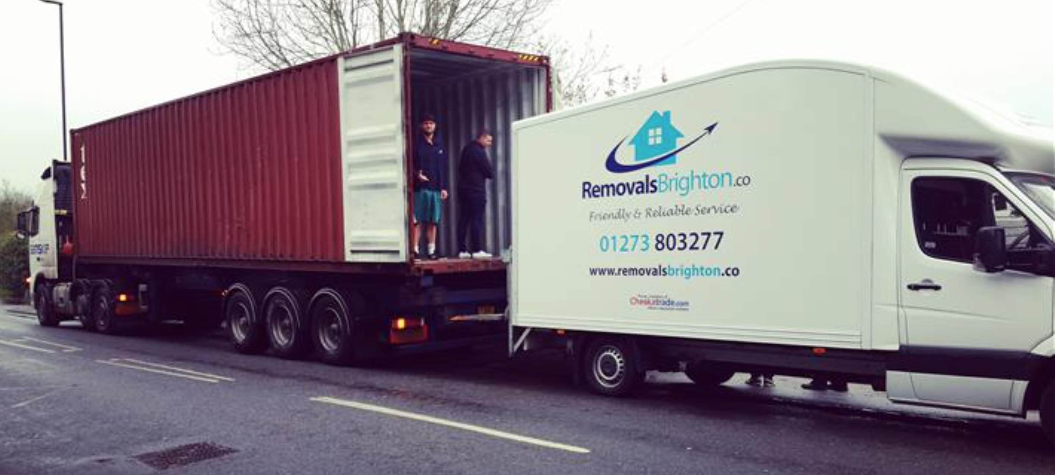 Removals Brighton van alongside a shipping container for long-distance move